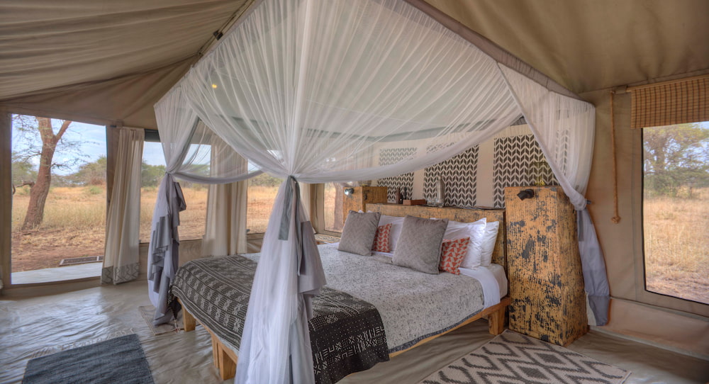 The simple but comfortable interior of a guest tent at Ubuntu Migration Camp.