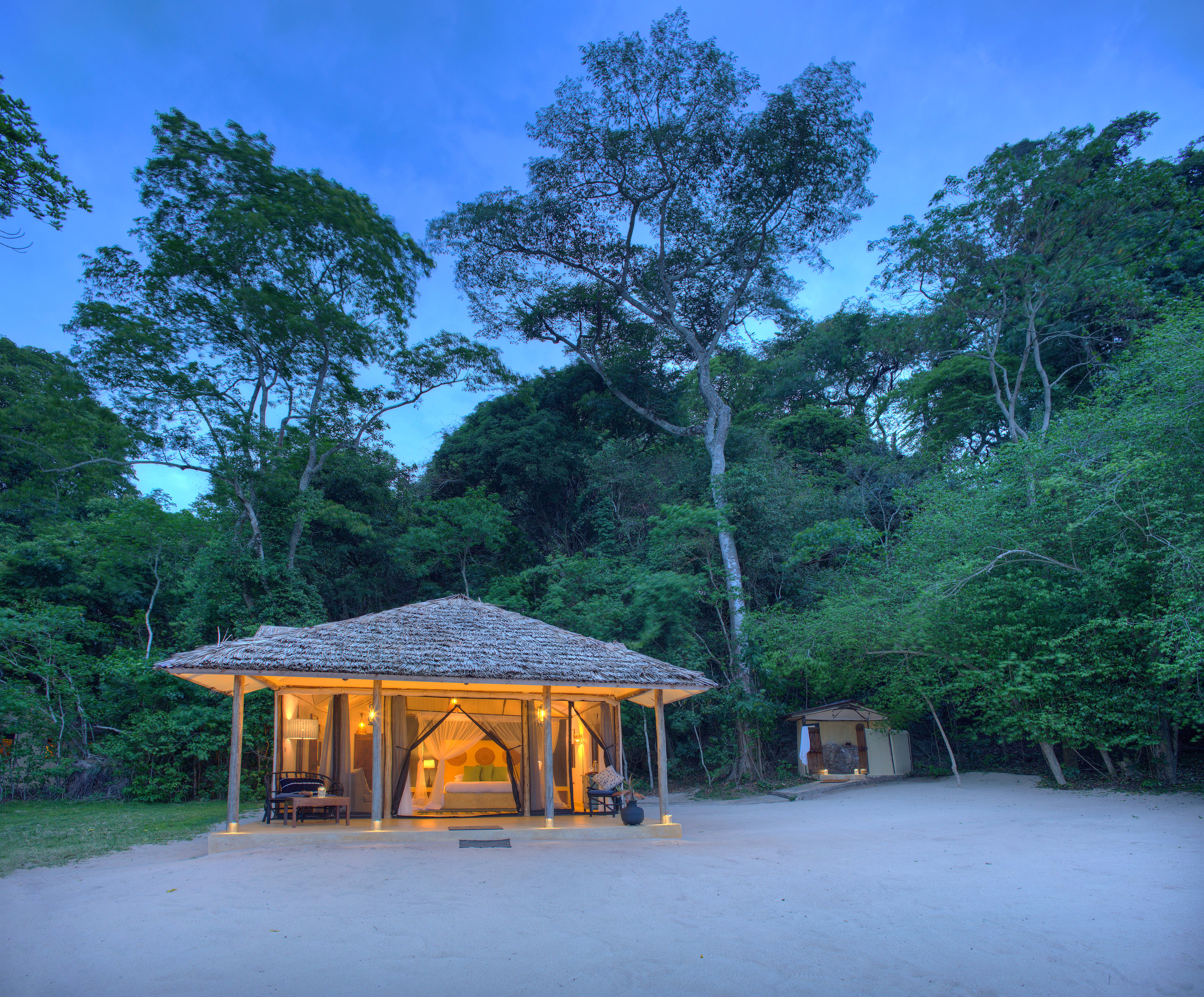 Rubondo Island Camp set between the sub-tropical forests and the sandy lake shore