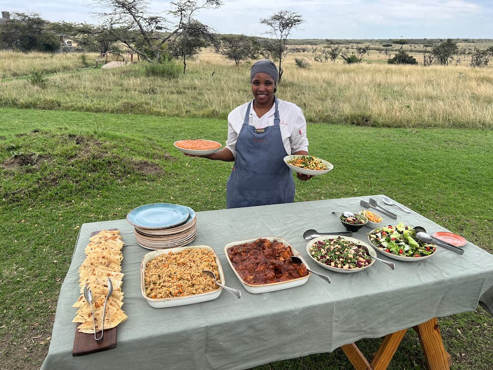 Diana, serving up her favourite curry for an al fresco lunch on the lawns at Naboisho Camp