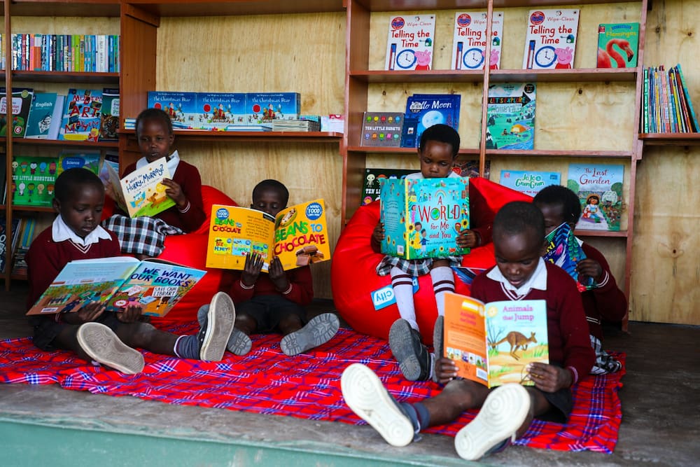 A library, made from a container, offers children fun and informative reading matierial.