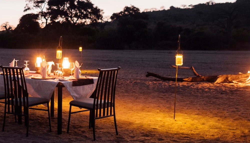 The dry riverbed in front of Kwihala Camp provides the perfect location for a romantic private dinner.