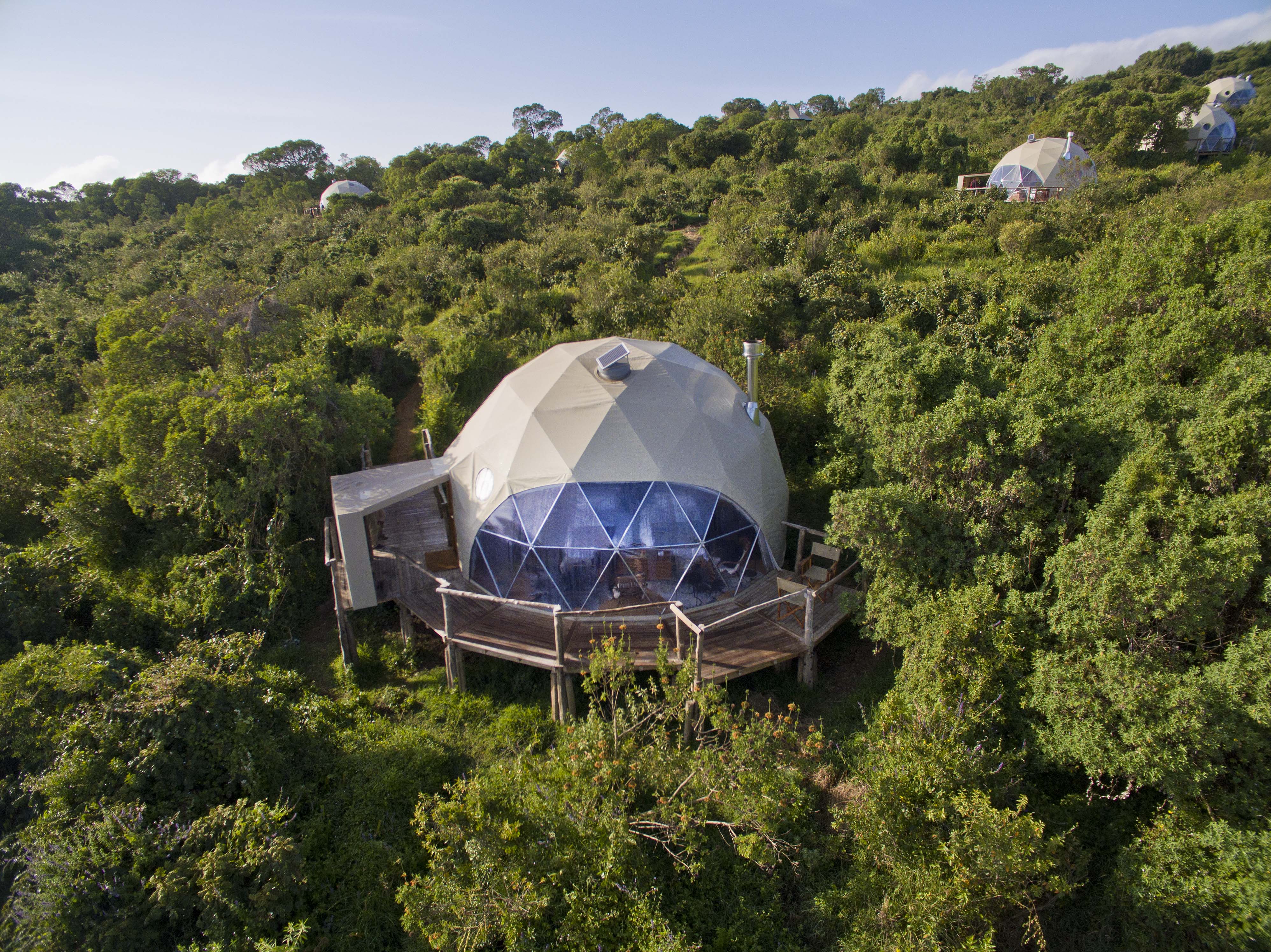 An aerial view of The Highlands' domed suites seen tucked amongst the natural foliage