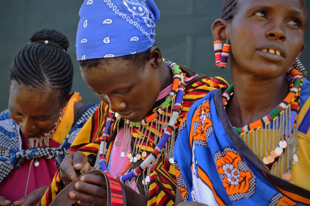 Maasai ladies create intricate and colourful beaded items