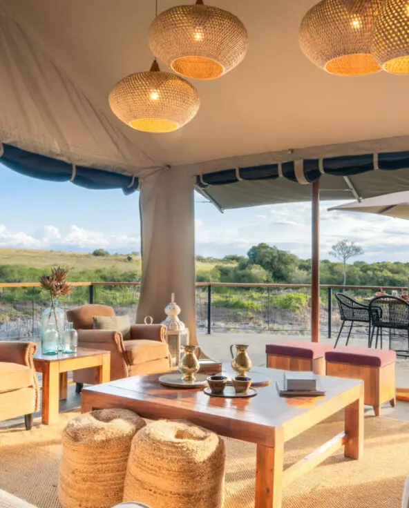 The stylish lounge area at Rekero with comfy sofas, ottomans, and a coffee table