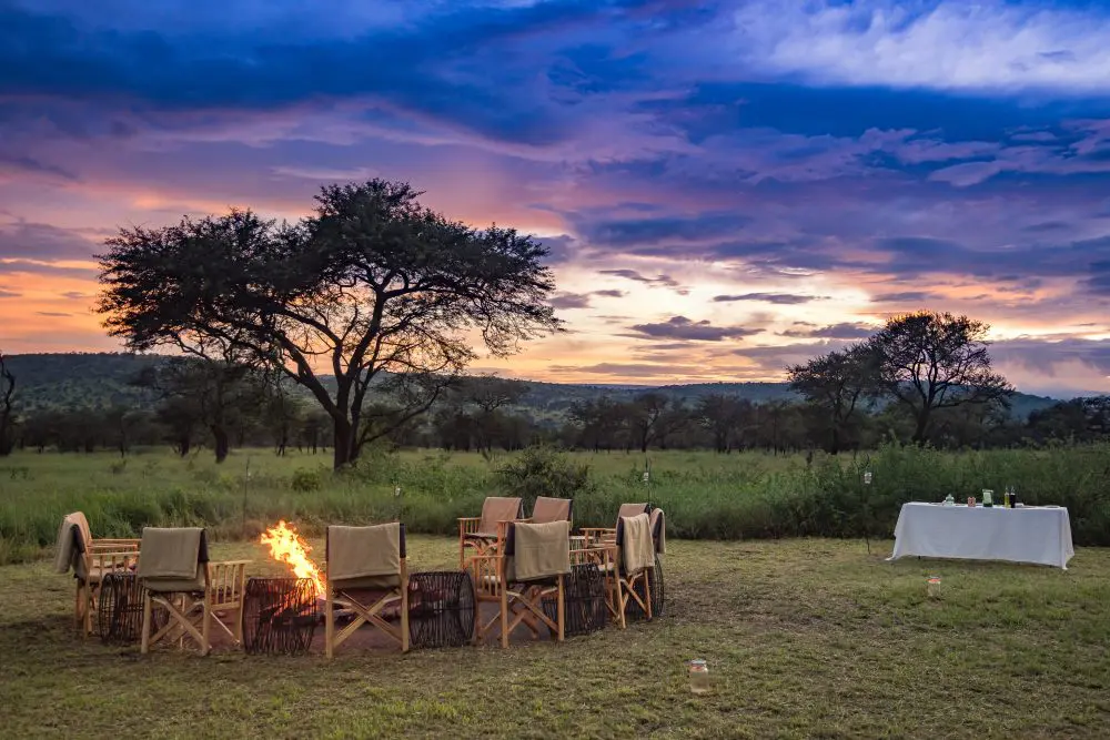 Sunset by the fire pit at Dunia Camp