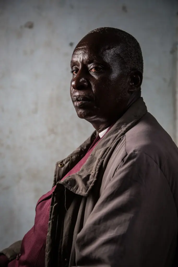 A side profile portrait of a Kuria elder not wearing traditional clothing.