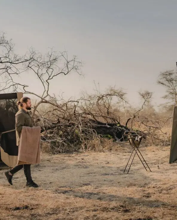 A fly camping setup from Usangu Camp with a star bed and bucket shower in Ruaha National Park