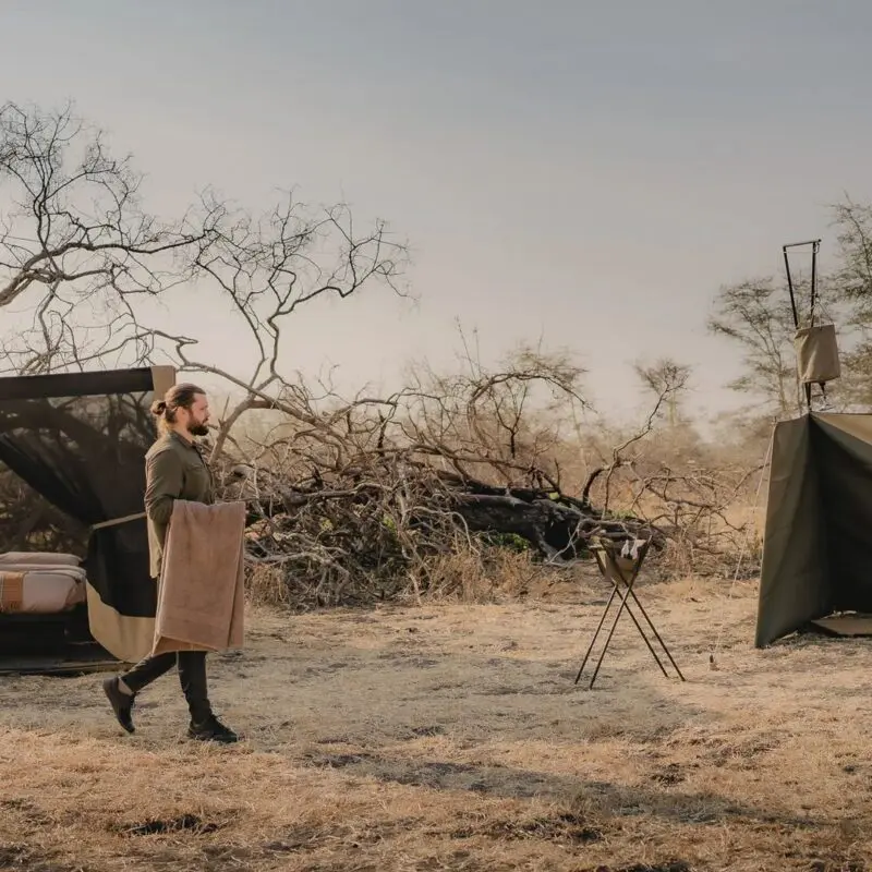 A fly camping setup from Usangu Camp with a star bed and bucket shower in Ruaha National Park