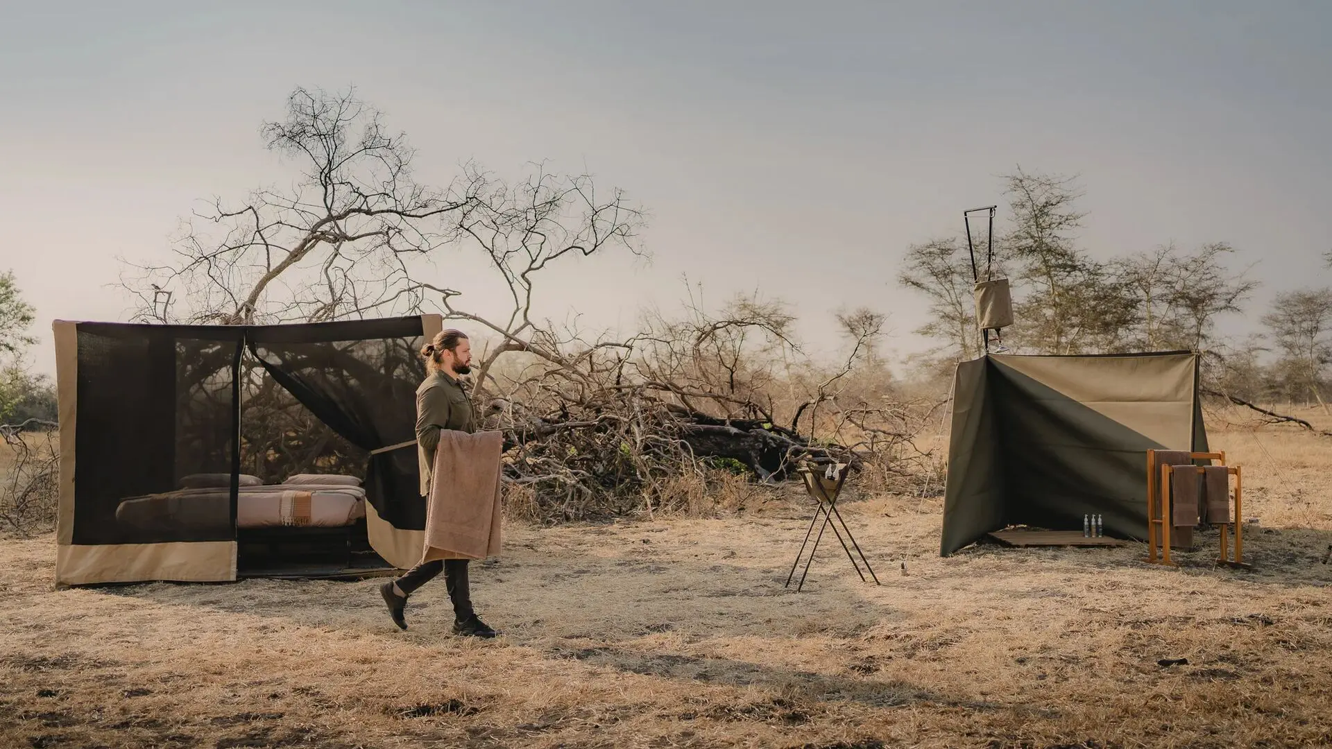 A fly camping setup from Usangu Camp with a star bed and bucket shower in Ruaha National Park