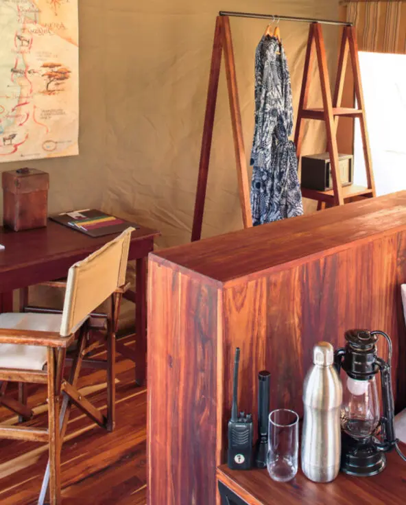 Inside guest tent, desk and back of bed, olakira migration camp, Serengeti National Park, Tanzania