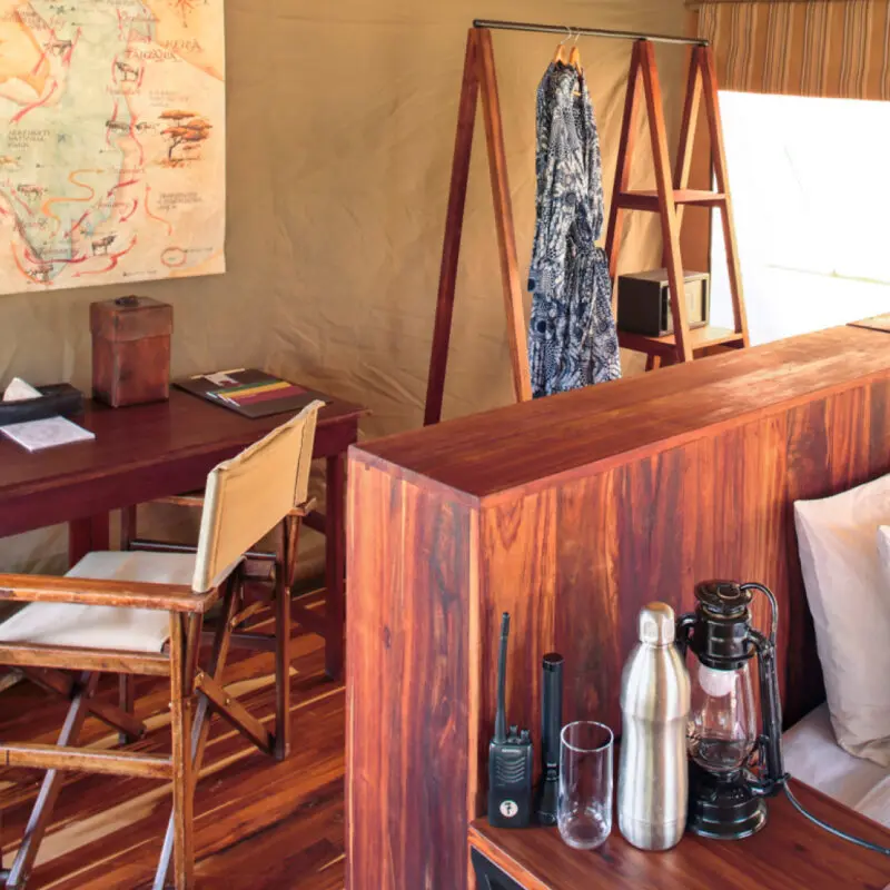 Inside guest tent, desk and back of bed, olakira migration camp, Serengeti National Park, Tanzania