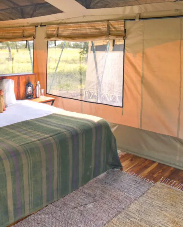 Inside view of bed in guest tent, olakira migration camp, Serengeti National Park, Tanzania