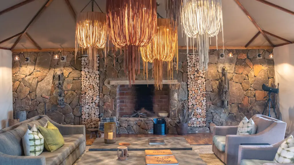 Sayari Camp, Northern Serenegeti, indoor fireplace, Lounge Area, hanging lights