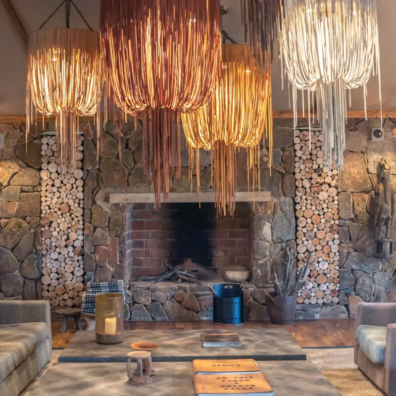 Sayari Camp, Northern Serenegeti, indoor fireplace, Lounge Area, hanging lights