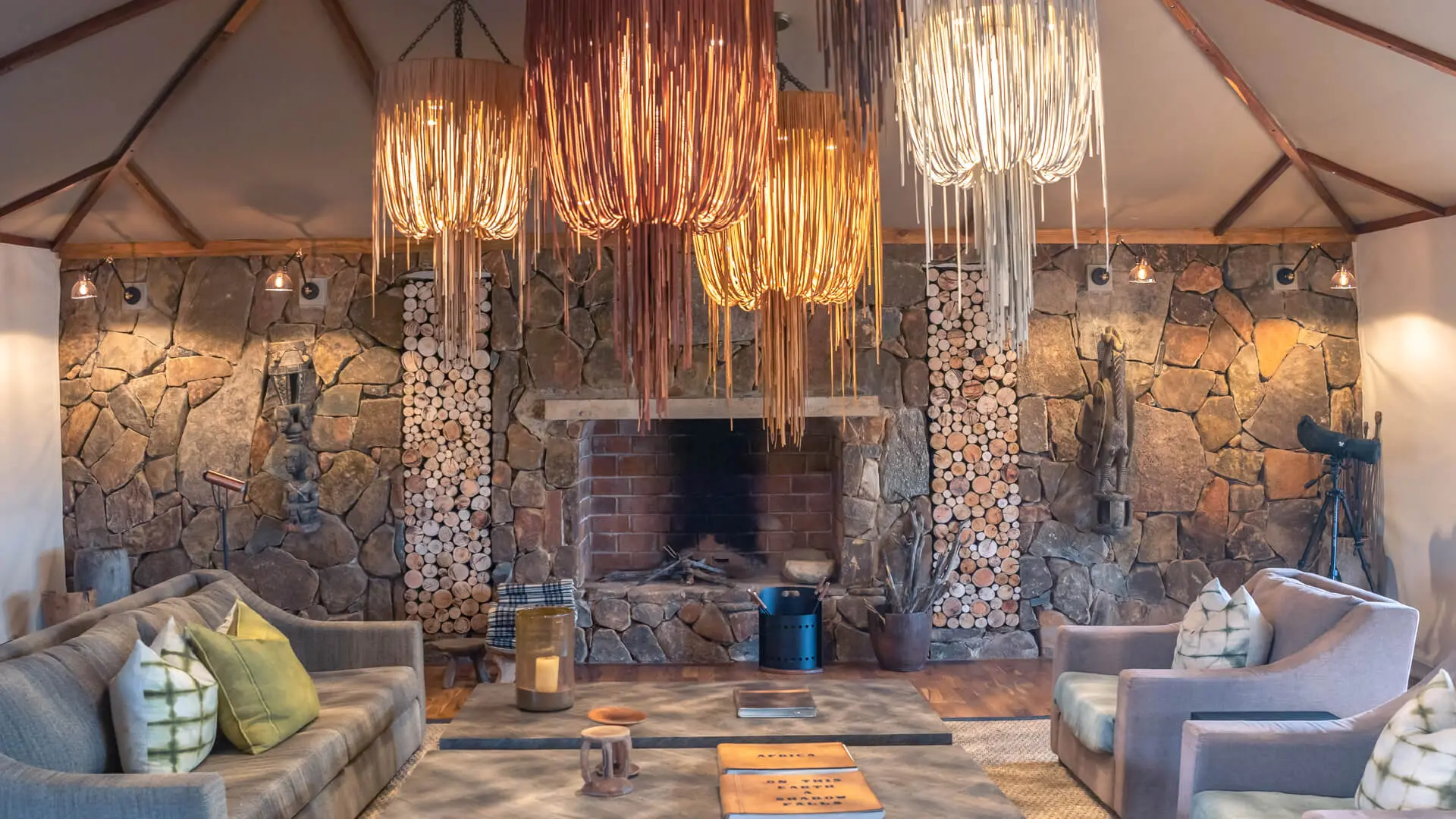 Sayari Camp, Northern Serenegeti, indoor fireplace, Lounge Area, hanging lights