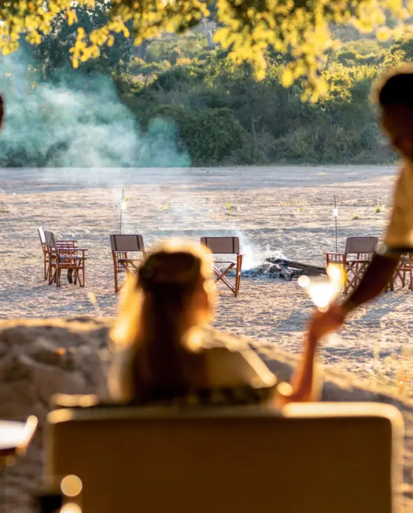 A guest enjoys a quiet moment while being served a beverage