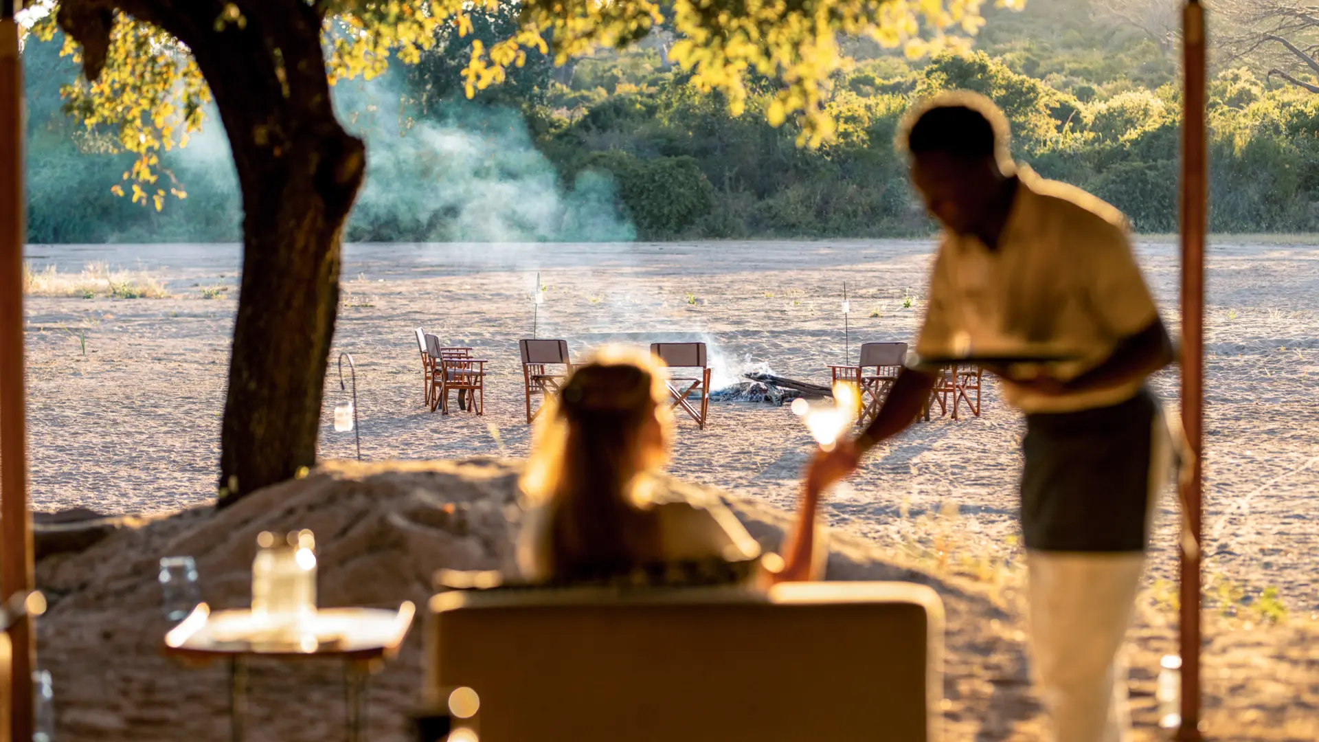 A guest enjoys a quiet moment while being served a beverage