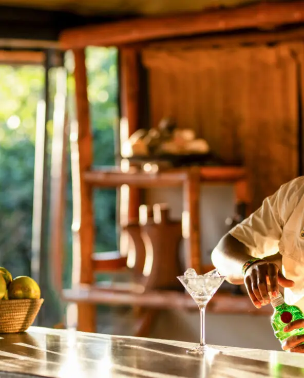 An Asilia bartender mixes a drink