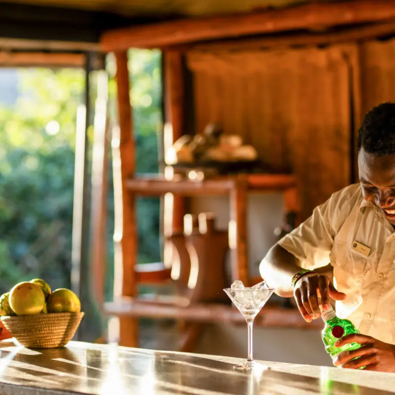 An Asilia bartender mixes a drink