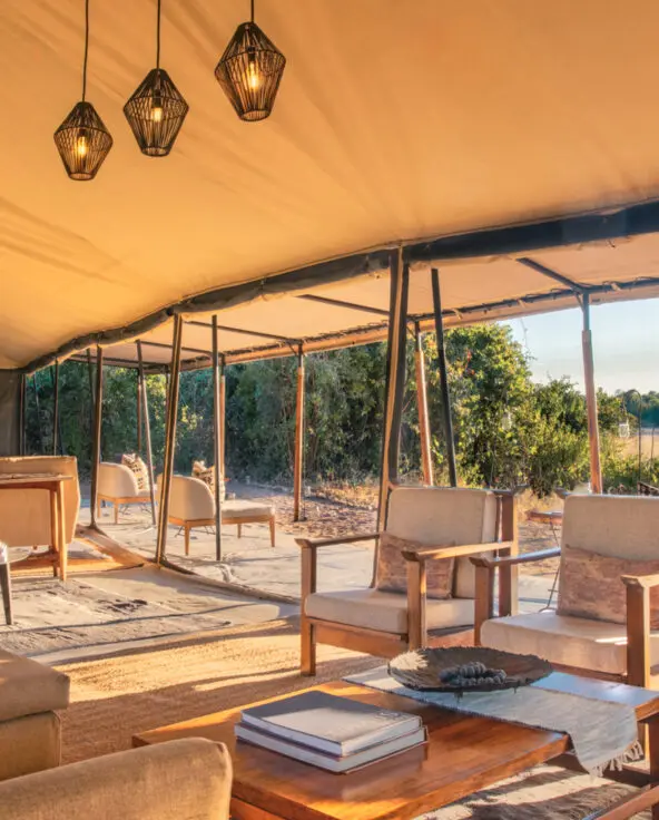 The tented lounge area at Kokoko, showing comfortable chairs and tables where guests can relax