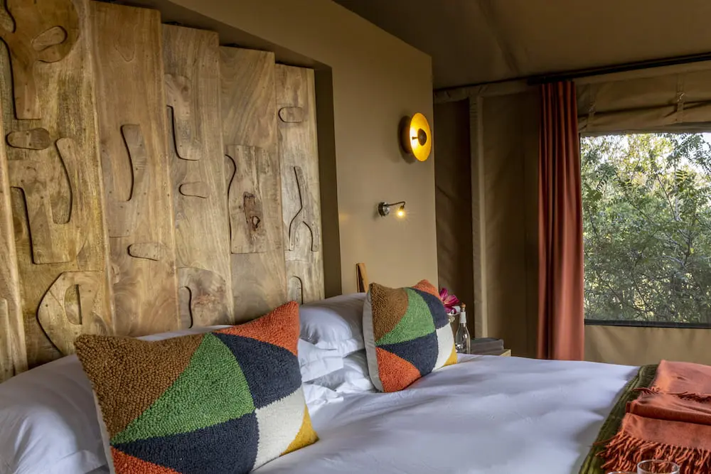 Carved wooden shutters in the guest suites at Naboisho
