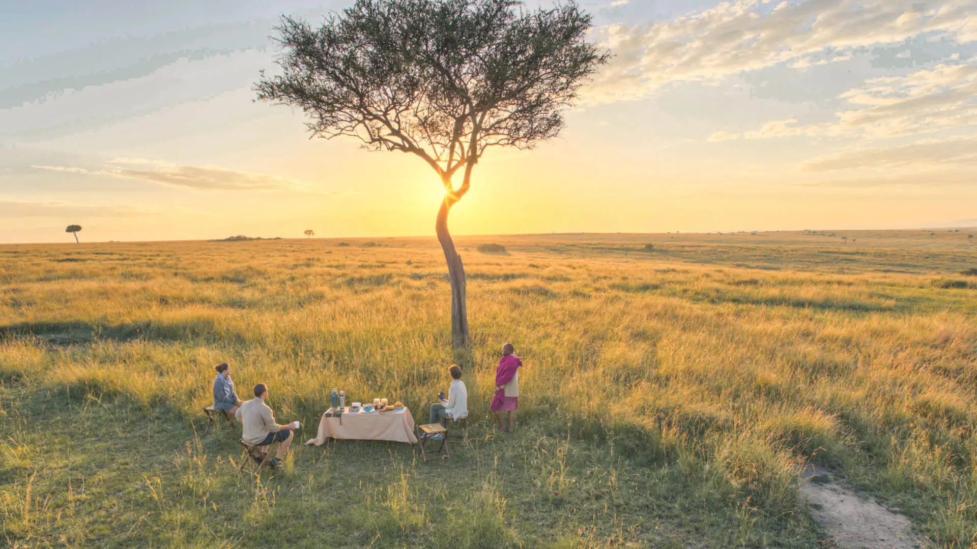 Sundowners on safari in the masai mara kenya