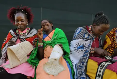 Ladies creating beadwork at The Maa Trust