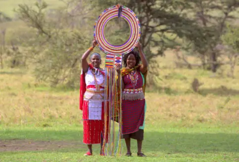 Maasai Women holding the Supersized Traditional Maasai Necklace