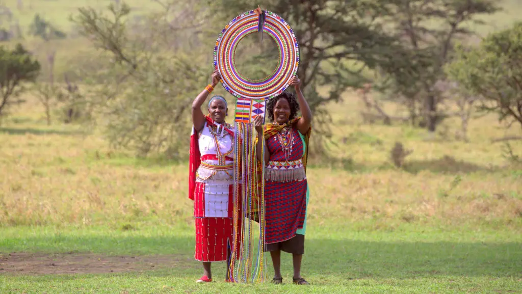 Maasai Women holding the Supersized Traditional Maasai Necklace
