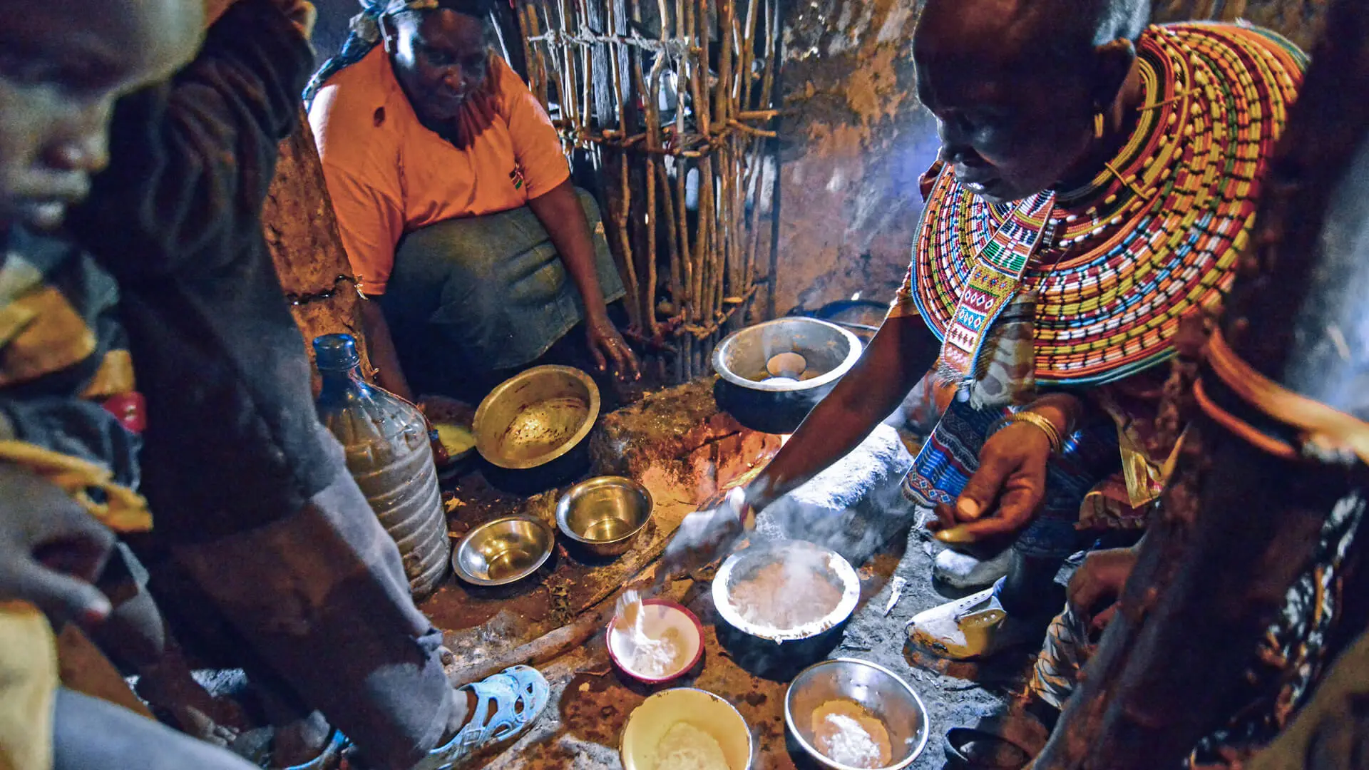 A Maasai family shares a meal