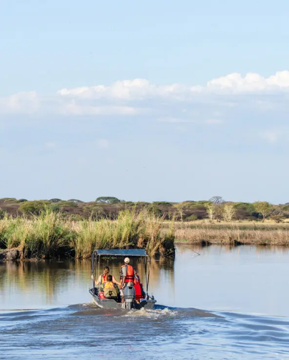 A boating safari on the waters near Usangu Camp in East Africa - Asilia Africa
