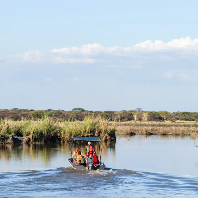 A boating safari on the waters near Usangu Camp in East Africa - Asilia Africa