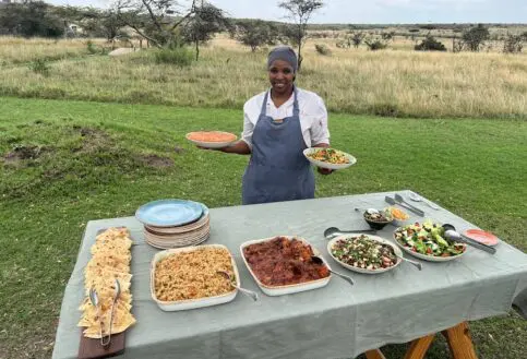 Diana, Head Chef at Naboisho Camp, serves a colourful lunch outdoors on the camp lawns | Asilia Africa