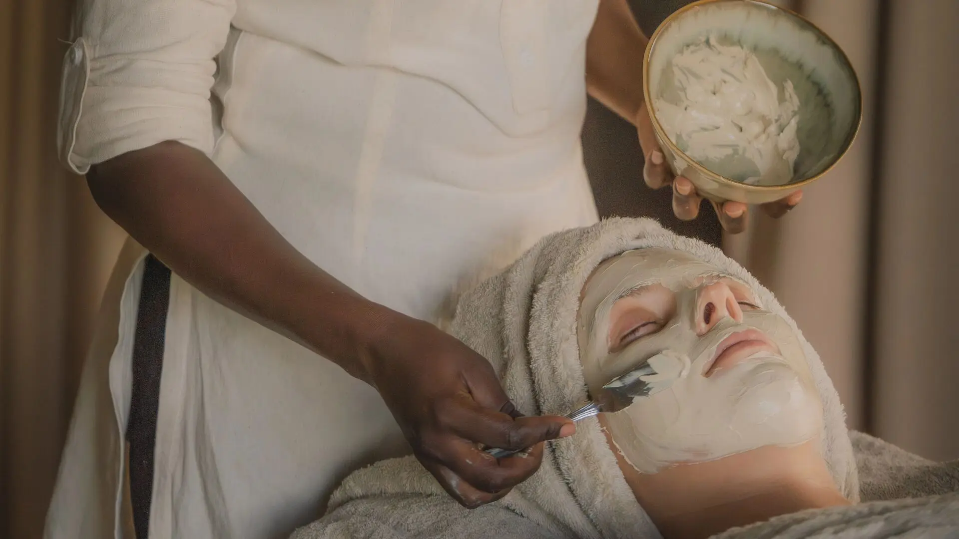 Guest enjoying a relaxing facial spa treatment at Naboisho Camp in Kenya.