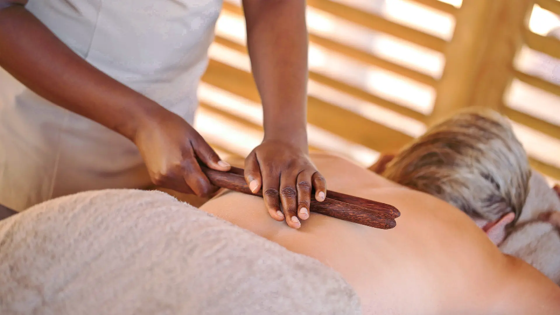 a guest receives a relaxing massage at jabali ridge - spa on safari - asilia africa
