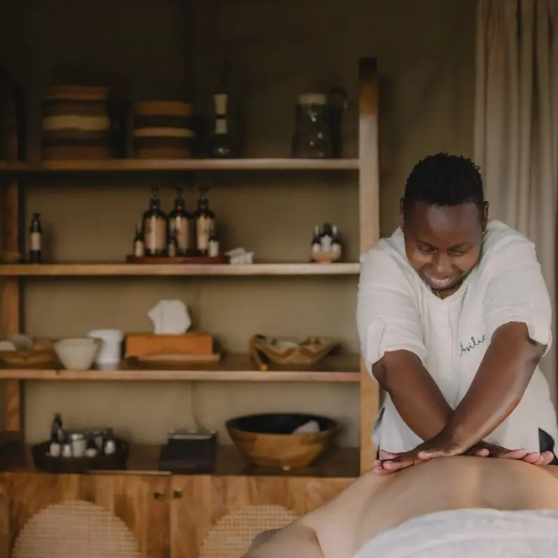 Guest enjoying a massage treatment at Naboisho Camp in Kenya.