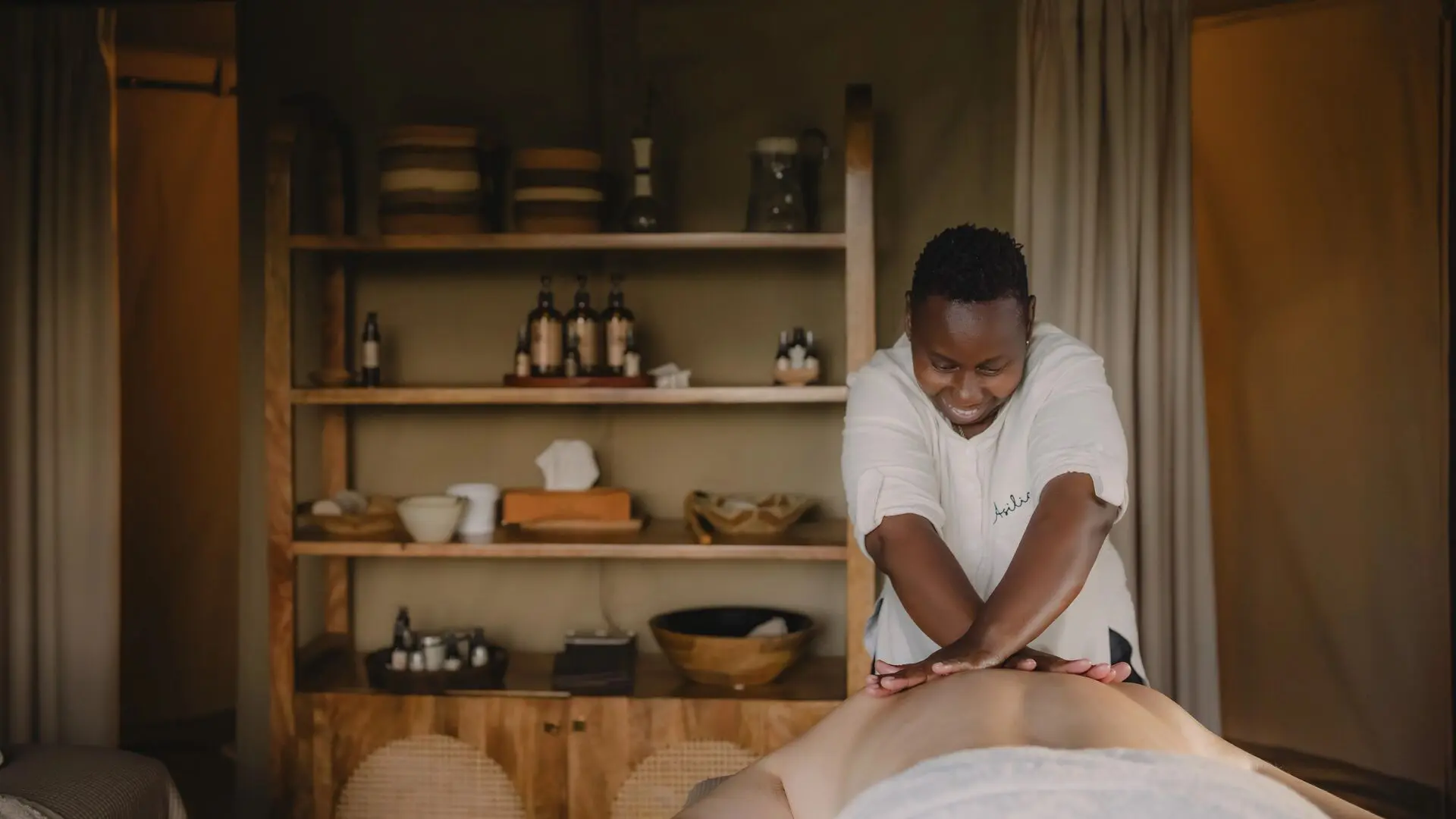 Guest enjoying a massage treatment at Naboisho Camp in Kenya.