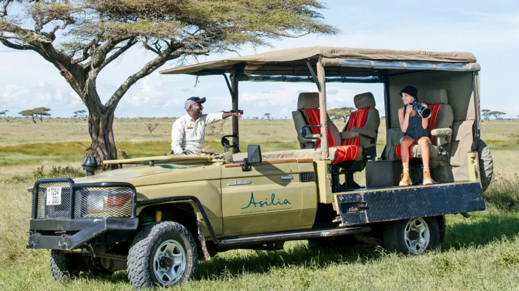 The photographic vehicle features drop down sides and rotating chairs.