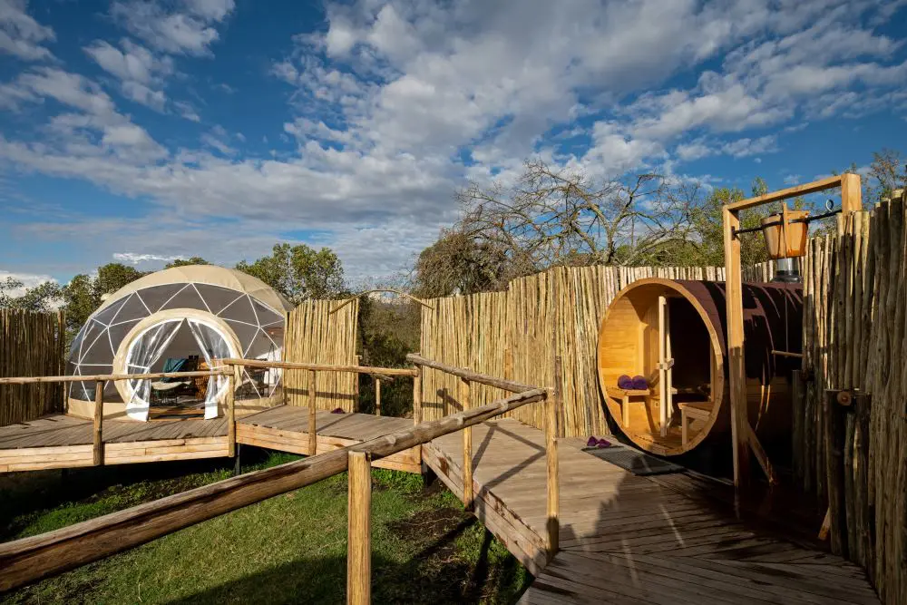 The spa boma, with a treatment tent and the barrel sauna.
