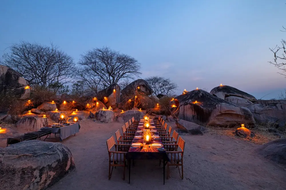The outdoor dining boma at Jabali Ridge, adorned with lanterns.