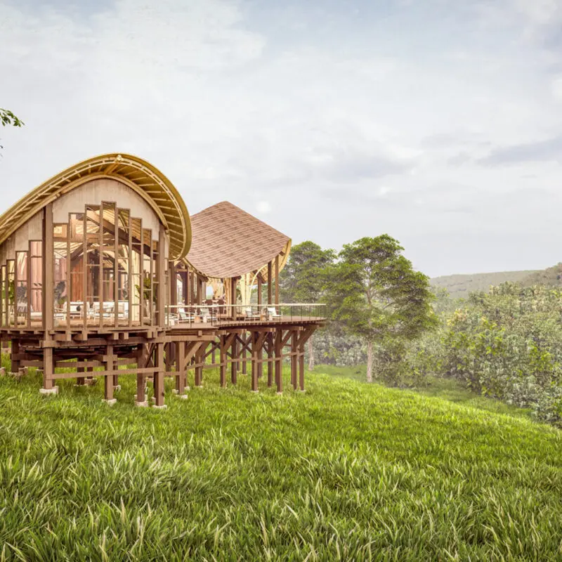 Render of the main area from the side on a grassy ledge amidst trees and greenery Erebero Hills Uganda