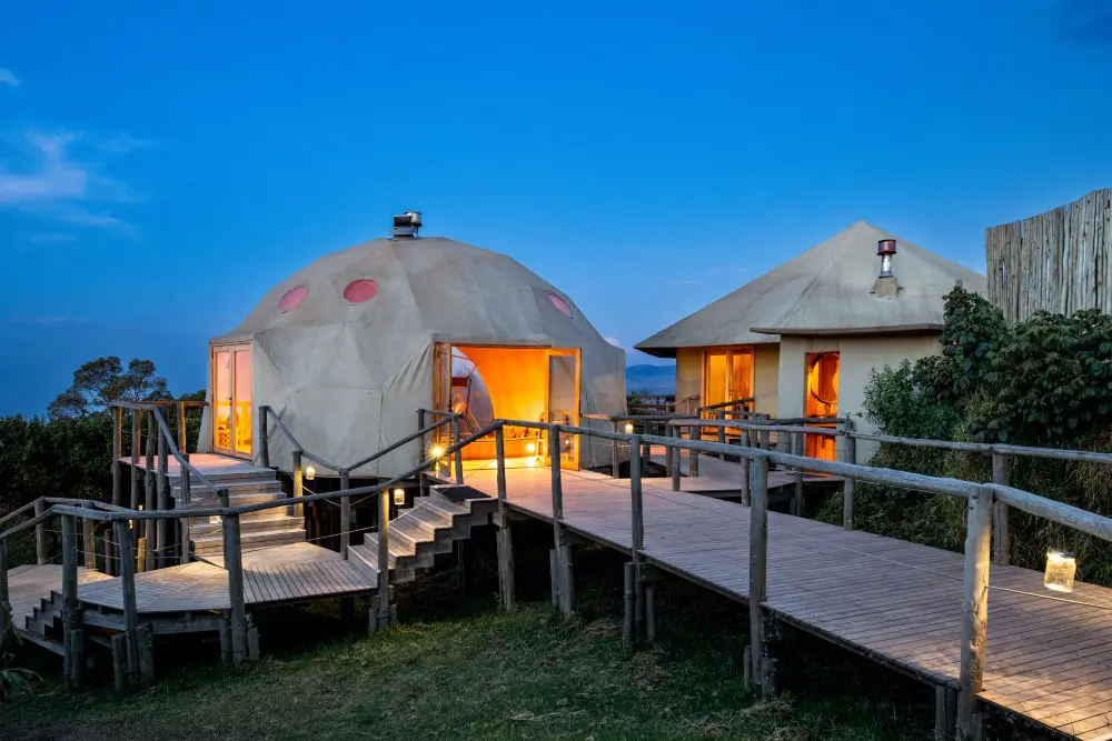 A wooden walkway leads to the communal lounge at The Highlands, Ngorongoro Conservation Area.