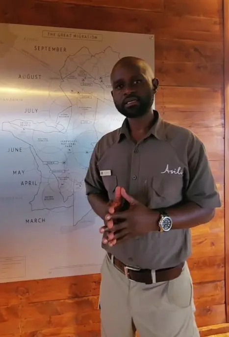 Charles in Sayari Camp, explaining the movements of the Great Migration through the Serengeti.