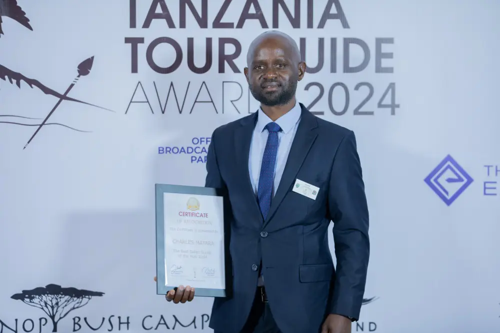 Charles, with the coveted Best Safari Guide of the Year award certificate.