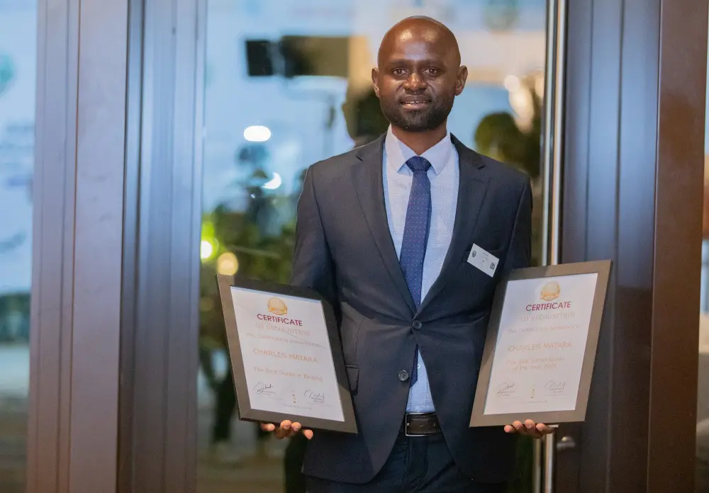 Charles, with two of the certificates on the night of the awards.