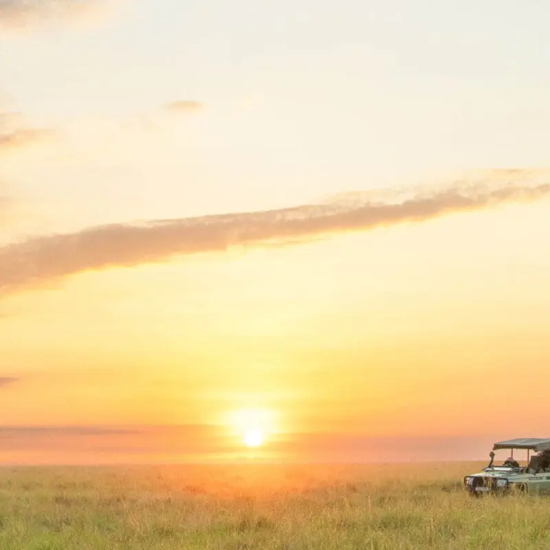 Vehicle parked for guests to enjoy the sunset in Masai Mara
