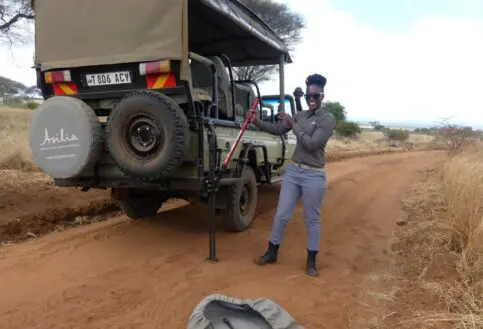 Grace demonstrates the correct use of the high lift jack, Tarangire National Park.