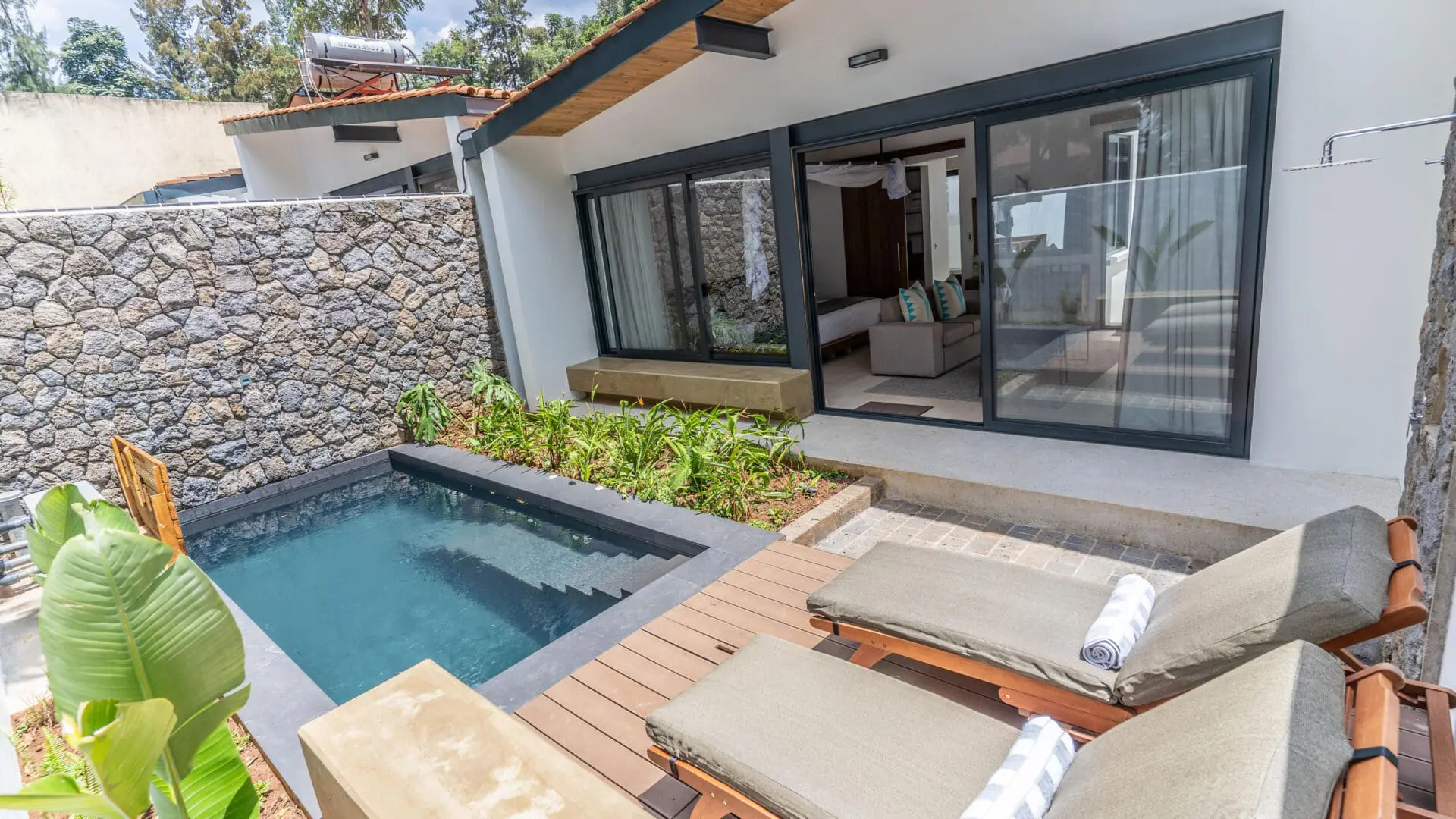 The Retreat - by Heaven guest villa with sliding door leading inside, loungers and plunge pool outside