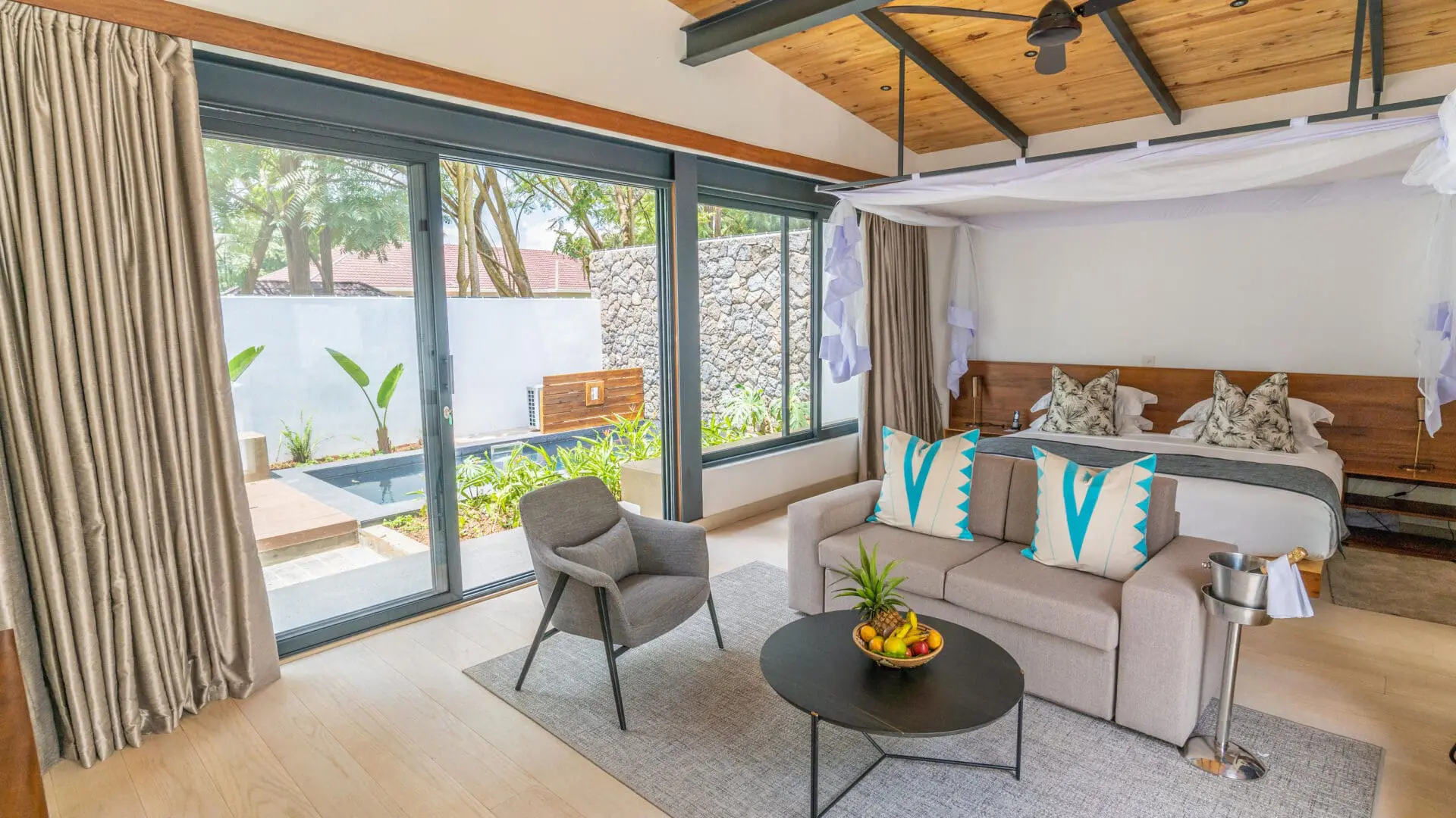 The Retreat - by Heaven_Pool villa interior, couch coffee table and double bed