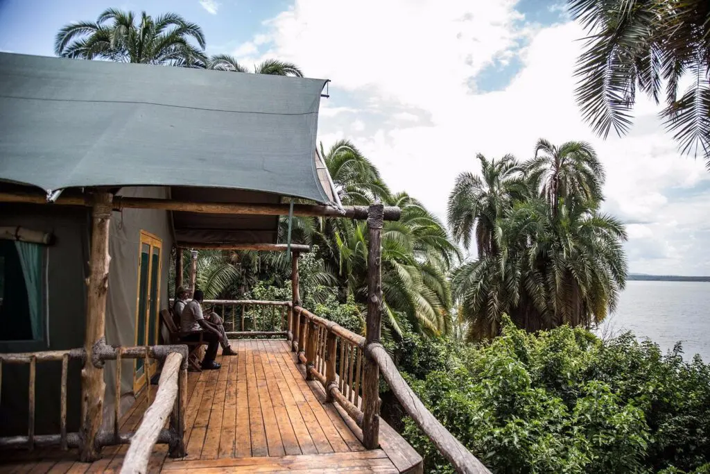 Ruzizi Tented Lodge walkway to tent entrance surrounded by lush trees